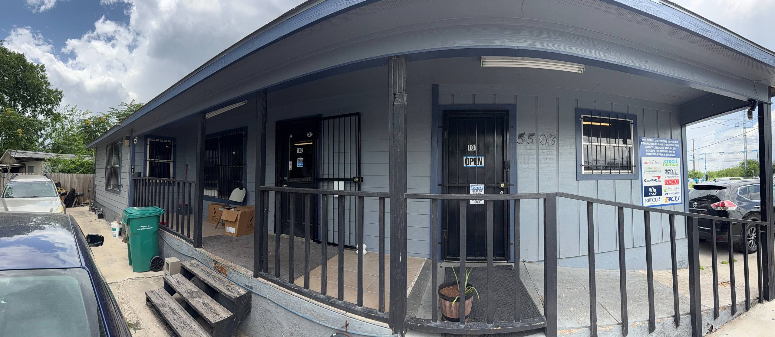 Panorama of the Aleman Auto Sales lot and front porch on Old Highway 90 West.